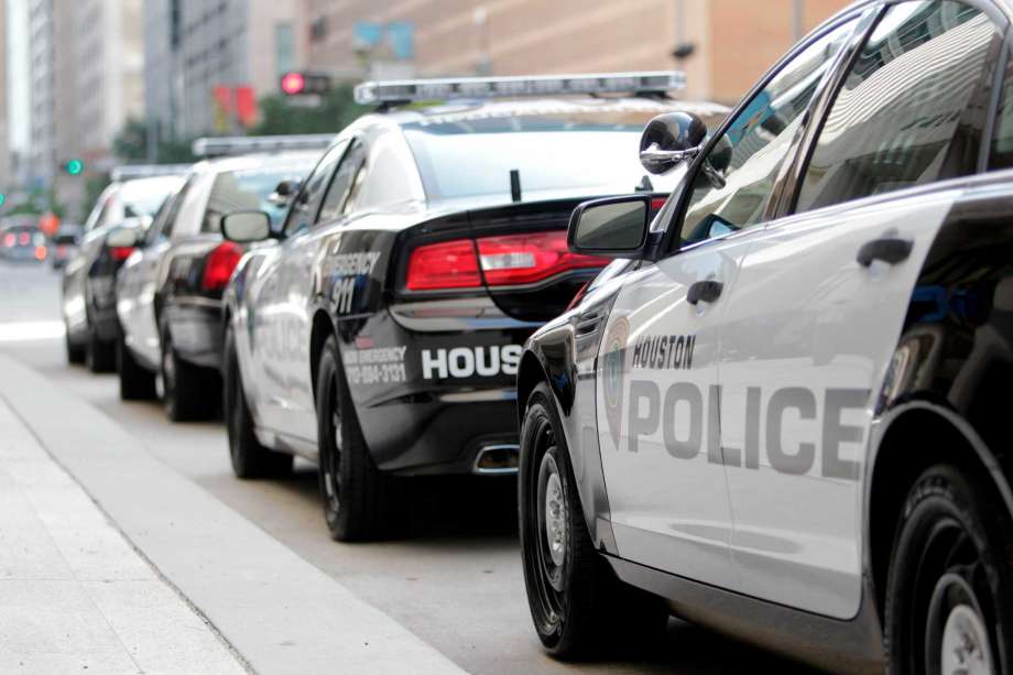 Houston Police Department patrol cars parked outside HPD's downtown headquarters. Photo: Mayra Beltran, Staff / © 2012 Houston Chronicle