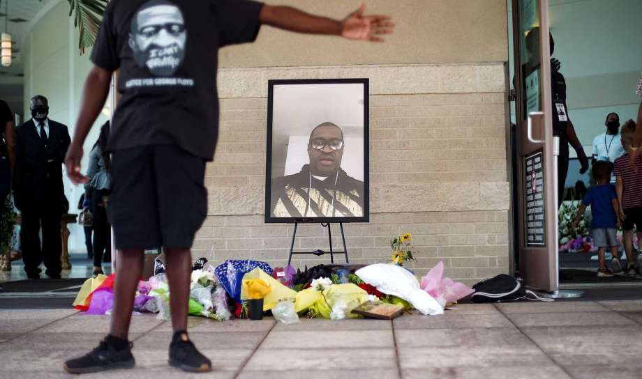 Flowers in front of a portrait of George Floyd on Monday, June 8, 2020, at The Fountain of Praise Church in Houston. Photo: Elizabeth Conley, Houston Chronicle / Staff Photographer / © 2020 Houston Chronicle